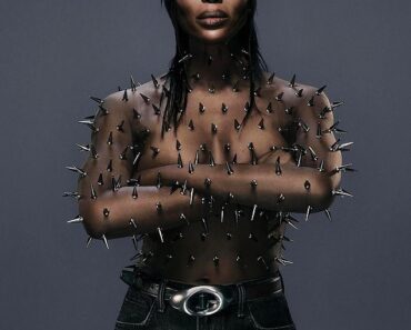 Supermodel Naomi Campbell poses nude with her entire body covered in silver spikes
